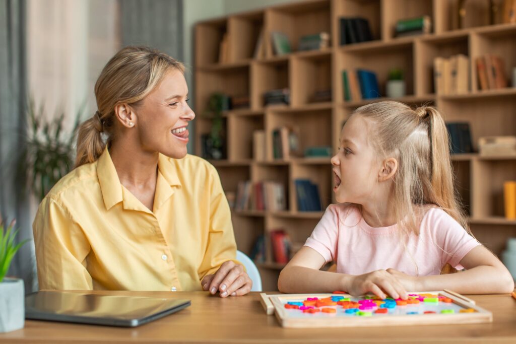 speech therapist working with little girl